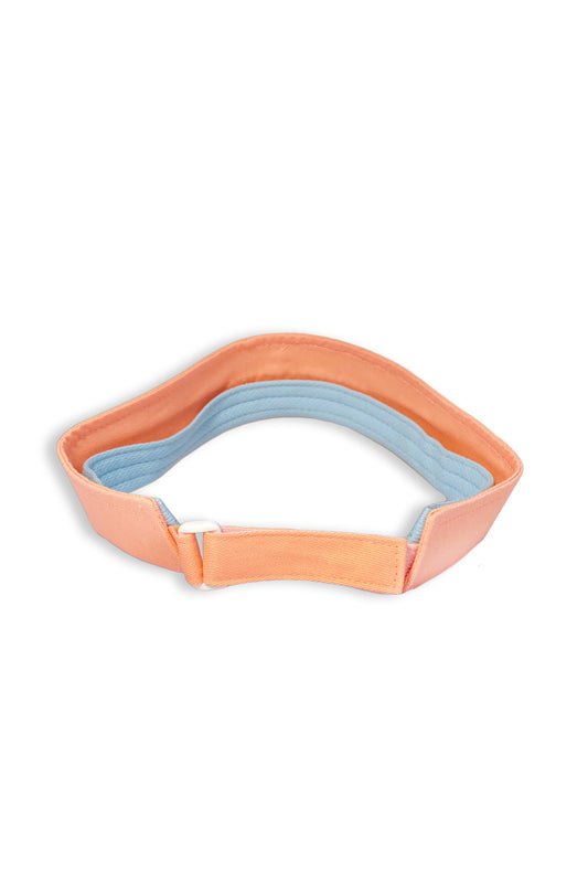 Our favorite visor is perfect for running, golfing, hiking, or serving it up during tennis! Mesh band that helps keep you cool and soaks up all that hard work.&nbsp; &nbsp;Southern Saint embroidered on the front.  Shown in our Perfect Peach with Chambray embroidery.