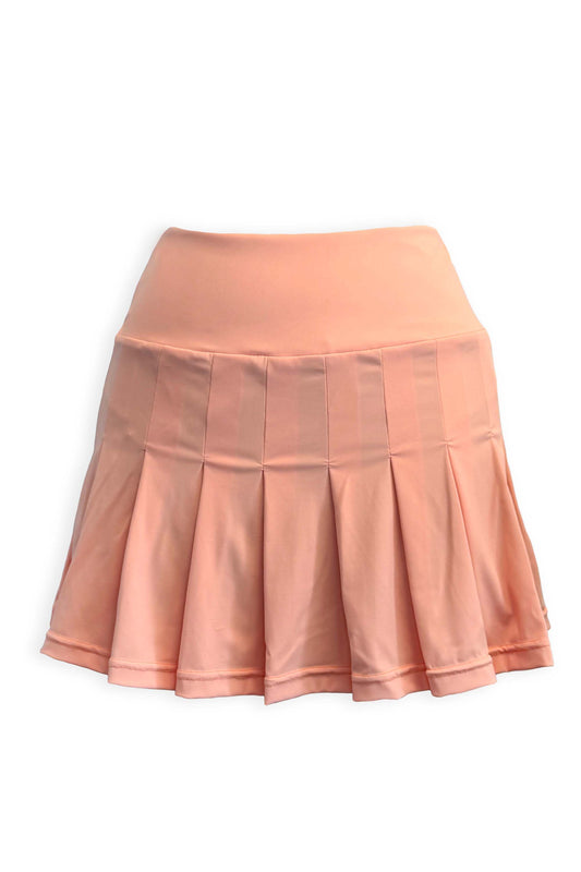 Peach pleated tennis skirt in soft, stretchy and sustainable fabric. Built in shorts with pockets in blue and white seersucker fabric with the brand's Mongoose logo printed on the back of the waist.